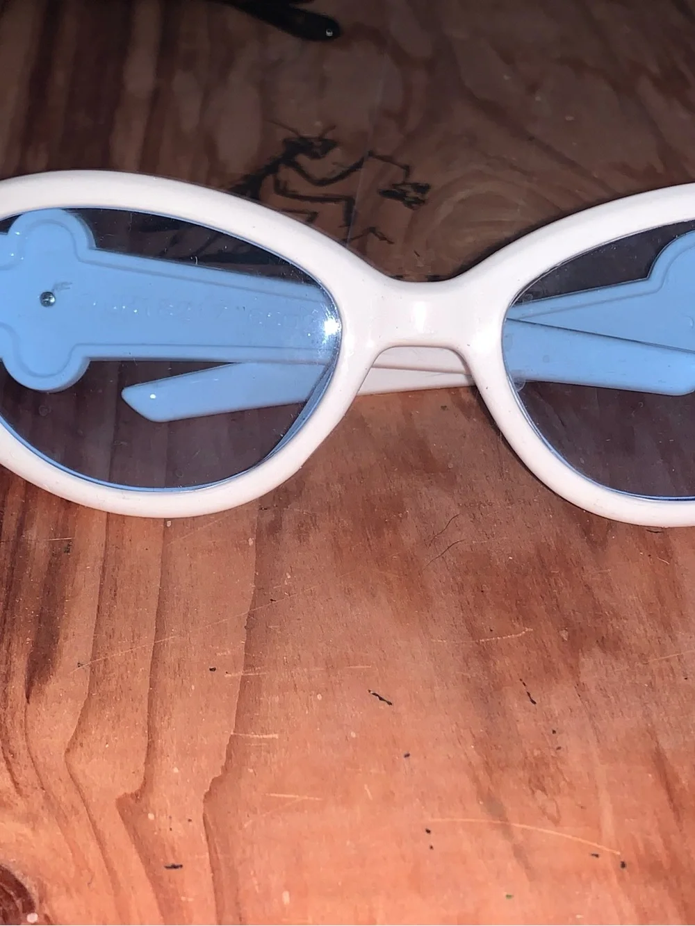 White Oval Sunglasses with Light Blue Lenses